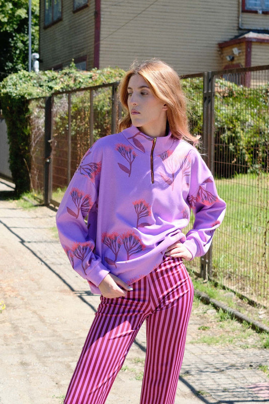 POLERON CIERRE FLORES FUCSIA