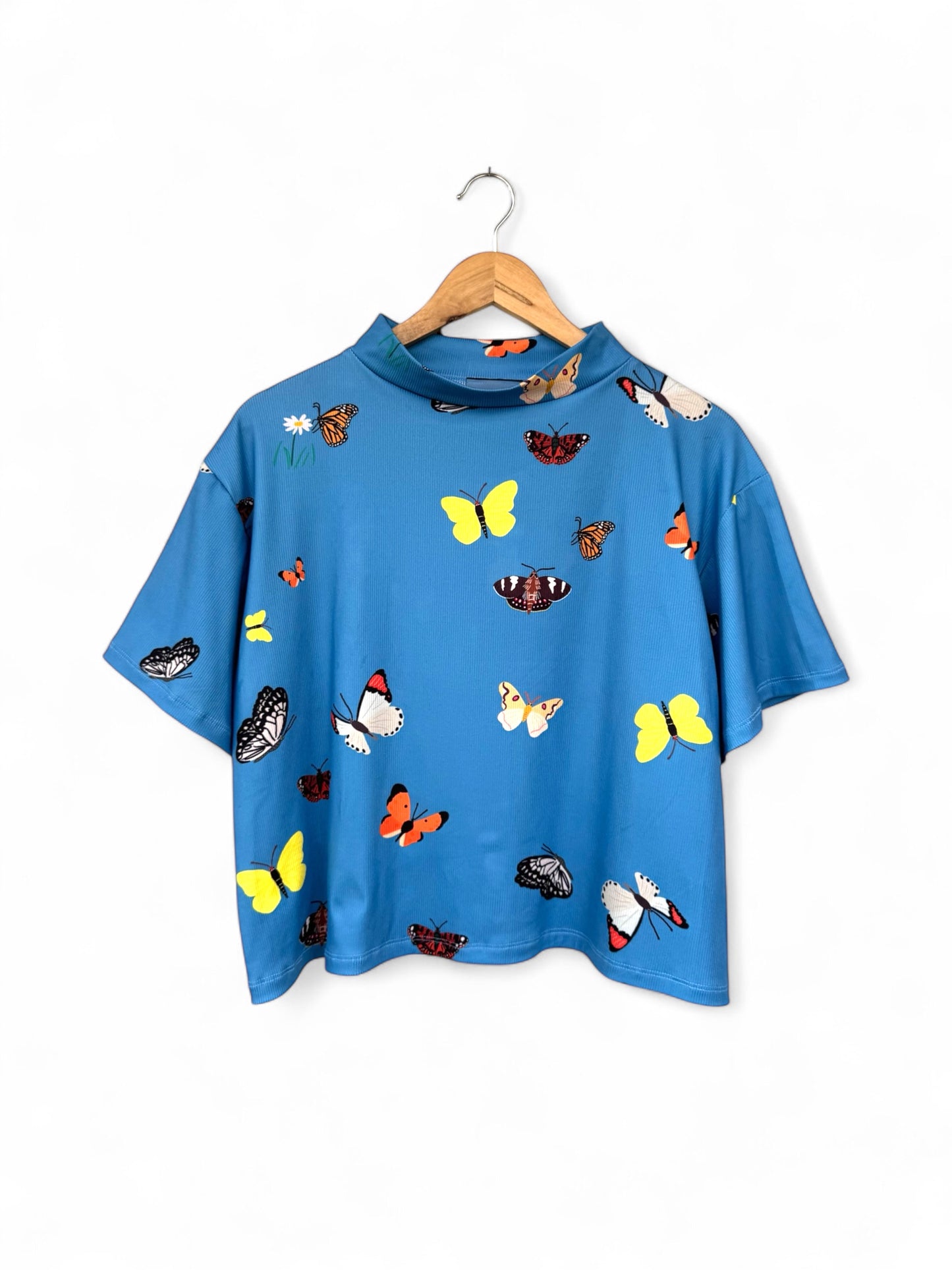POLERA TORTUGA MARIPOSAS CELESTE