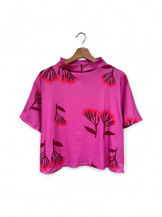 POLERA TORTUGA FLORES FUCSIA
