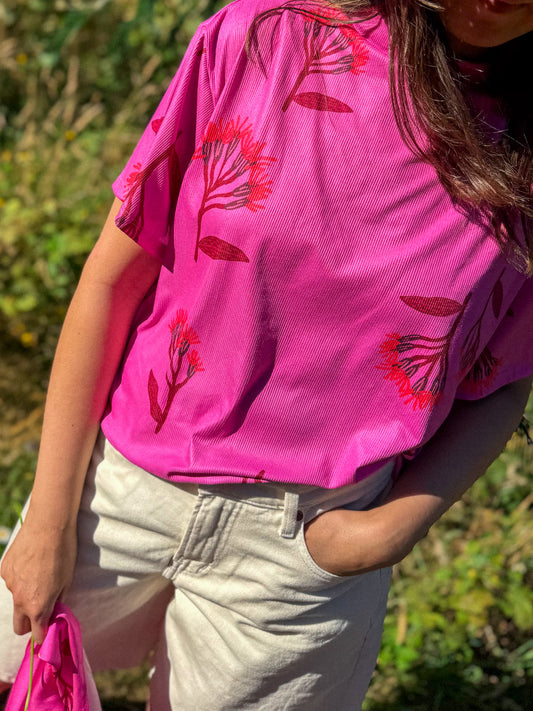 POLERA TORTUGA FLORES FUCSIA