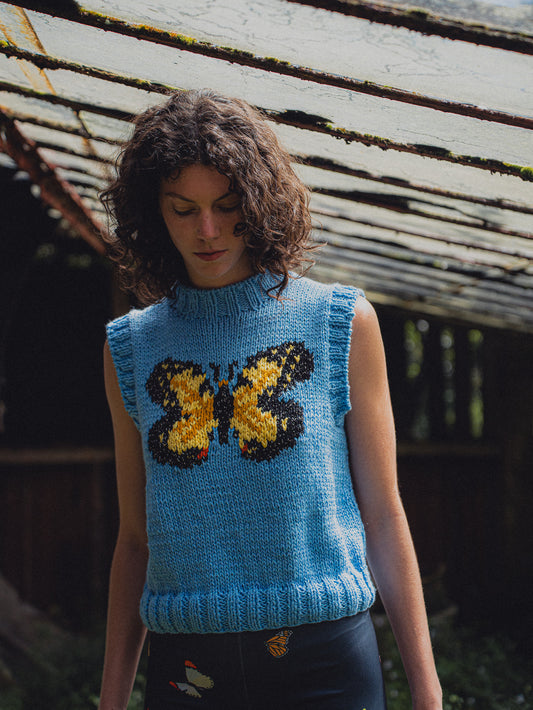 SWEATER SIN MANGAS MARIPOSA CELESTE