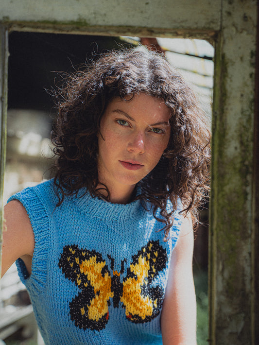SWEATER SIN MANGAS MARIPOSA CELESTE